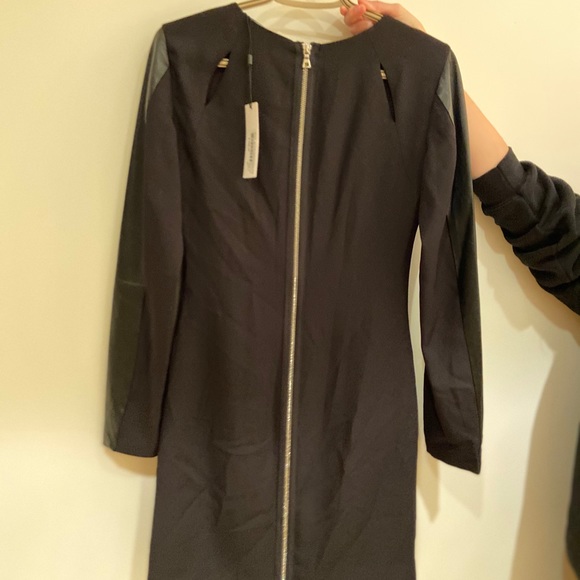 Black dress with cut outs and leather sleeves - Picture 2 of 3